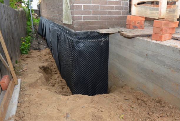 Happy homeowners after waterproofing job in Rarden